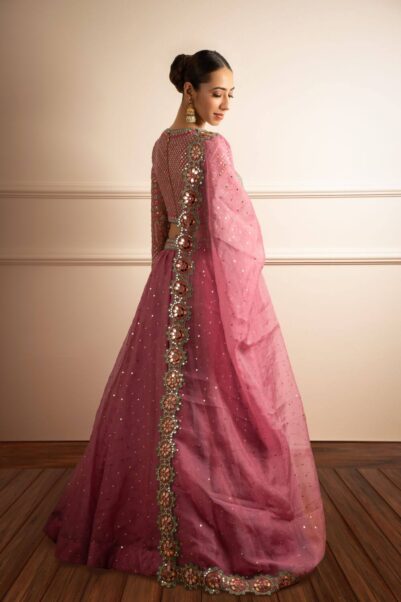 Elegant bridal lehenga designed by Vvani, featuring a blend of traditional patterns and contemporary craftsmanship.