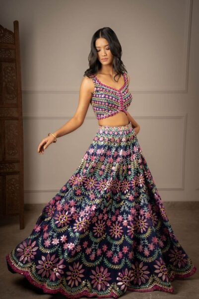 Chic designer lehenga in maroon with heavy embroidery and a statement blouse - aneesh agarwaal