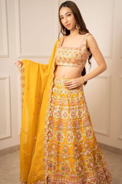Yellow Lehenga Set With Multicoloured Detailing by Aneesh Agrawal