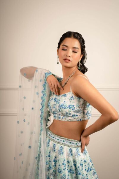 Beautiful pastel lehenga with floral motifs, embroidery and delicate embroidery details in bridal fushion- Anita dongre