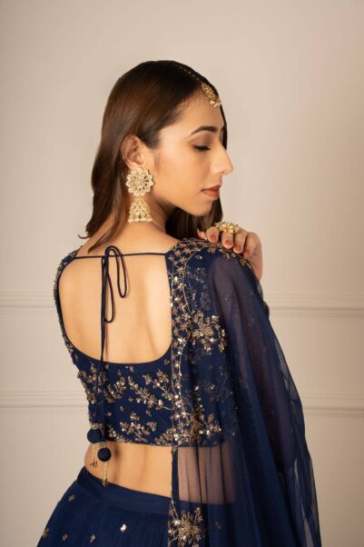 Traditional green bridal lehenga with golden embroidery and matching dupatta - astha narang