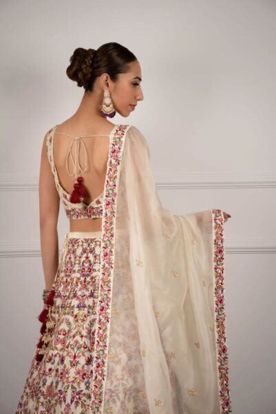Classic white lehenga with subtle detailing, showcasing the sophisticated elegance of Chamee and Palak designs.
