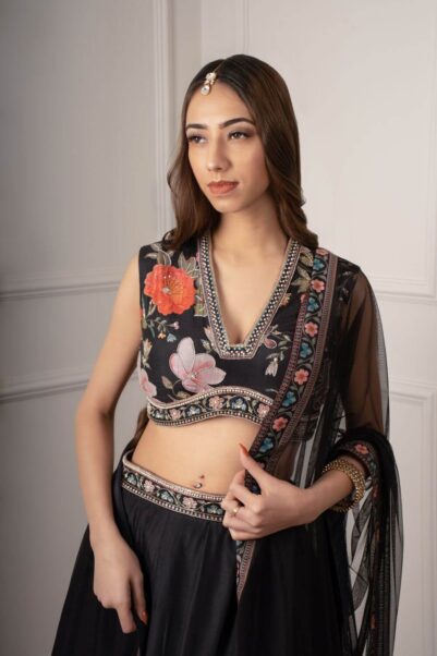 Modern peach lehenga set with intricate embroidery, reflecting Ridhi Mehra's contemporary design philosophy.