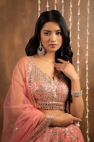 Charming pink lehenga with intricate threadwork perfect for receptions - Seema Gujral's romantic style